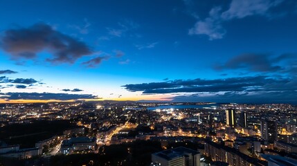 Fototapeta premium Vibrant night skyline panorama showcasing glowing city lights contrasted against twinkling twilight sky : Generative AI
