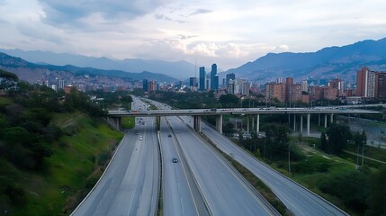 Fototapeta premium Dramatic skyline view of a bustling city with mountains in the background and highways filled with cars under a cloudy sky : Generative AI