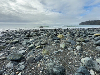 Waves breaking on a rocky beach on Vancouver Island on a cloudy day