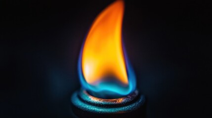 Blue-orange flame burns bright, dark background, energy