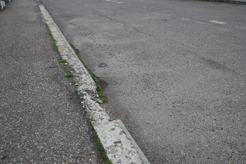 Fototapeta premium Degraded public road accession way