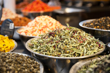 Linden, oregano, chamomile, and red rose petals tea for sale in bulk in a bowl.