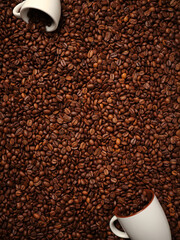 Top view of many roasted coffee beans and coffee cups with beans.