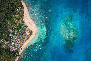 reathtaking Aerial View of Daku Island, Siargao – A Tropical Haven with White Sand Beaches, Crystal-Clear Waters, and Lush Greenery, Offering a Perfect Island Escape!