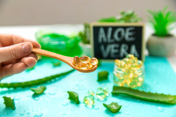 Aloe vera capsules and extract drops. Selective focus.