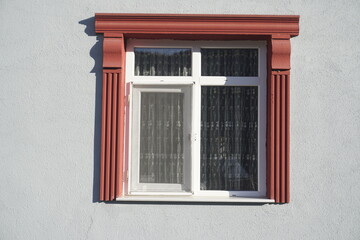 Window Framed with Red Decorative Foam Trim