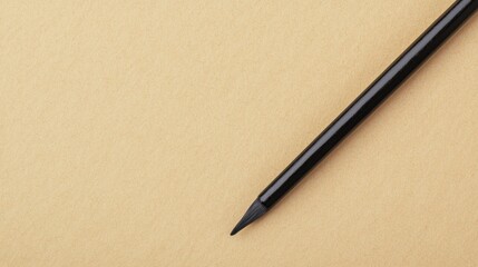 Zen productivity focus and meditation, A close-up of a black pencil resting on a smooth, beige surface, highlighting its sharpened tip and simple elegance.