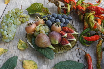 Assorted Fruits and Dried Chilies on a Wooden Plate