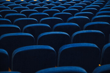 Fototapeta premium Blue empty seats in the audience prepared for the participants of the conference or presentation
