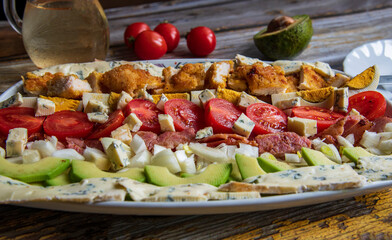 The Cobb salad, American garden salad with avocado 
, chicken white meat, onion, boiled egg...