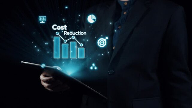 A businessman in a suit holds a tablet displaying cost reduction graphics and digital icons, illustrating financial analysis and strategic management in a professional context. Qubit