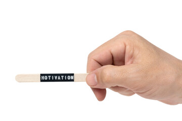 Hand holding wooden stick with inscription motivation is highlighted on white background.