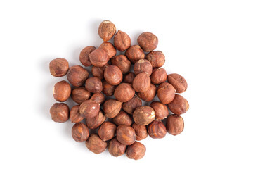 Pile of hazelnuts isolated on white background, top view.