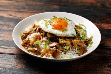 Hawaiian Loco Moco with hamburger, fried egg and brown mushroom gravy