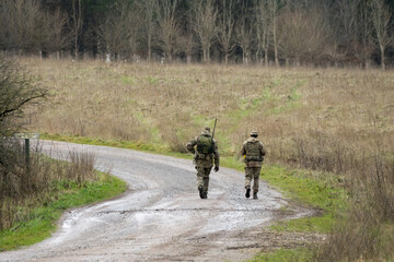 two British army infantry soldiers on a tab tabbing exercise