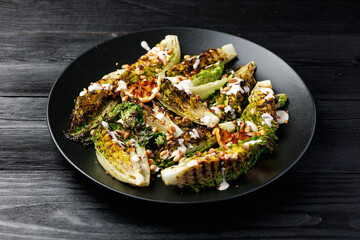 Grilled little gem lettuce with aioli sauce, roasted pine nuts and chilli flakes. Healthy Low carb...