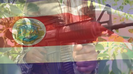 Aiming rifle through foliage, soldier with flag overlay and emblem visible - Powered by Adobe