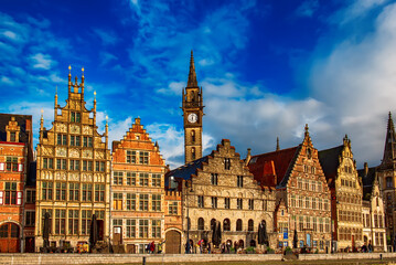 Ghent city historical center, tourists boats and colorful buildings on Leie river bank, Belgium