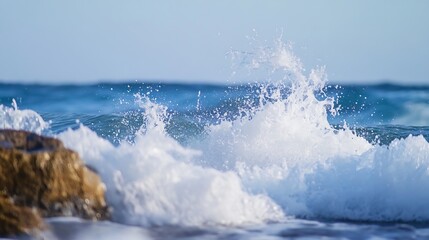 Fototapeta premium Energetic ocean waves crashing against the rocks under a bright sunny sky showcasing nature's power : Generative AI
