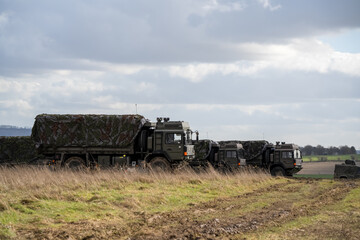 Naklejka premium several British army MAN SV 4x4 utility truck on a military exercise