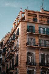 Fototapeta premium Beautiful European apartment building facade windows and balcony