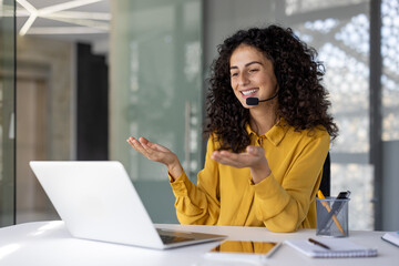 Support service worker at workplace inside office. Businesswoman talking using laptop for video...