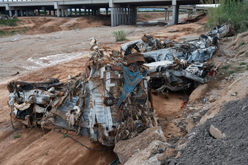 Flood-ravaged vehicles left abandoned in Rambla del Poyo after DANA storm