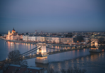 View on Chain Bridge and Parliament at night in Budapest
