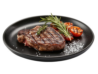 Beef steak, grilled, on a black plate, garnished with coarse salt, a sprig of rosemary and grilled tomatoes, isolated on a white background
