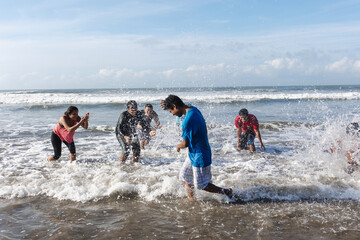 young latin friends having fun at beach at pacific ocean in Acapulco Mexico Latin America, hispanic...