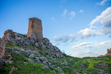 Detail of one of the ruined towers of the medieval Xiquena Castle atop a cliff in the city of Lorca, Murcia Region, Spain