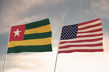 Relations between the countries of the United States of America USA and TOGO represented by the concept of two flags waving against a cloudy sky.3d render.