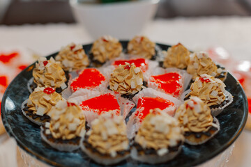 beautiful two types on a black plate on a festive table sweet treat