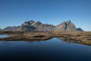 Vestrahorn mountain in Iceland and its reflection