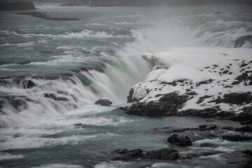 Urridafoss waterfall in Iceland on a foggy winter day