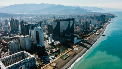 Batumi city with modern skyscrapers and hotels along the black sea coast, a vibrant and developing tourist destination in georgia, showcasing urban development and coastal beauty © wifesun