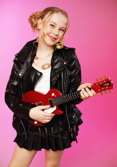Fototapeta premium Ten-Year-Old Rocker with Toy Guitar