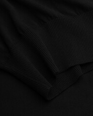 Close-Up of Elastic Hem on Black Wool Turtleneck