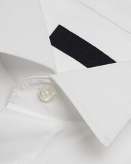 Classic white shirt wingtip collar made of textured fabric with mother-of-pearl buttons