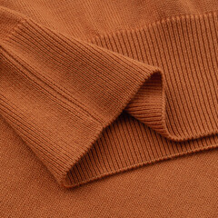 Elastic band of a terracotta orange knitted cotton polo t-shirt