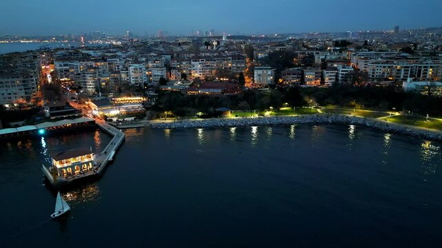 A drone flies over the famous pier in Moda district, Kadikoy, Istanbul, Turkey