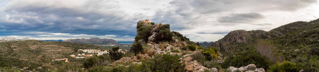 Ocaive's castle in the peak of the mountain, in Pedreguer, Comunidad Valenciana (Spain).