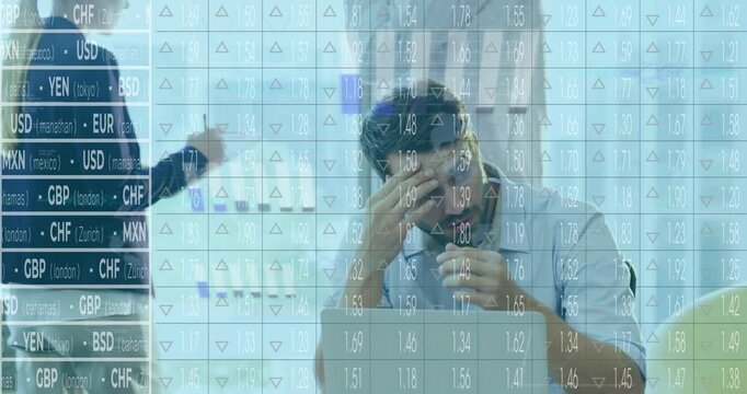 Analyzing financial data, businessman stressed with currency exchange rates in office