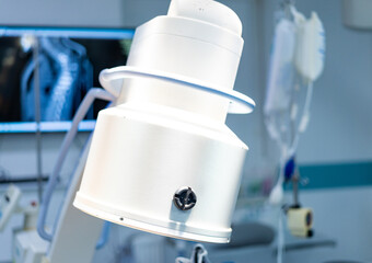 Surgical medical equipment. A sophisticated medical device is positioned in a bright surgical room,...