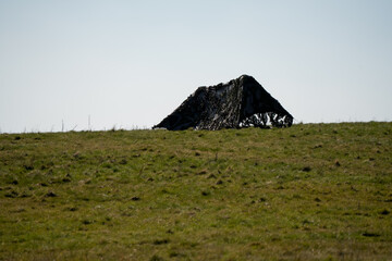 army camouflage netting covers transmission devices in a field