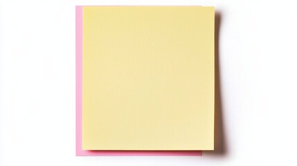 Fototapeta premium A stack of sticky notes in yellow and pink colors, perfect for reminders and organizing thoughts.