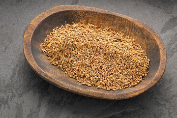 Fennel seeds in bowl - Foeniculum vulgare