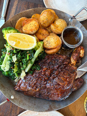 Lamb shoulder with potato and vegetables.