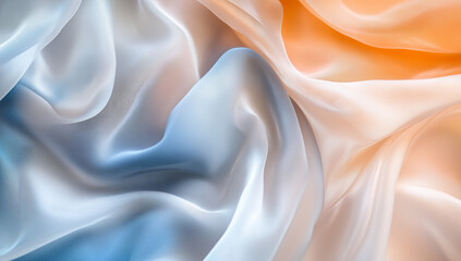 Obraz premium Flowing fabric dances in soft hues of blue, white, and orange under gentle light in a serene atmosphere