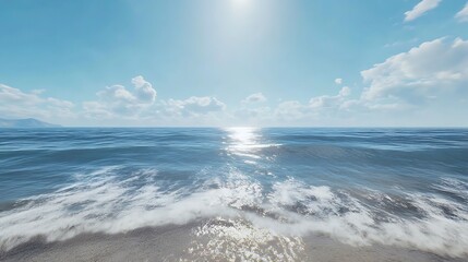 Fototapeta premium A serene ocean view under a bright sky with gentle waves lapping at the shore.